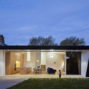 This black house features aluminium joinery from the architecture, elevation, estate, facade, home, house, property, real estate, residential area, roof, sky, window, teal