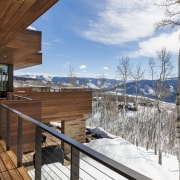 There is an intimate feel to this mountain apartment, architecture, cottage, home, house, log cabin, mountain, property, real estate, roof, siding, sky, snow, tree, winter, wood, white, brown