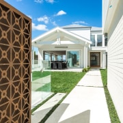 Metal gate and weatherboard walls on Devonport renovation architecture, building, estate, facade, home, house, property, real estate, white