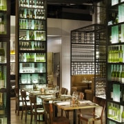 Two tall wine towers serve as dividers in distilled beverage, liquor store, brown