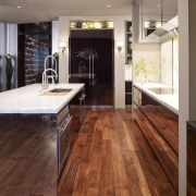 Polished stainless on the island and high gloss cabinetry, countertop, cuisine classique, floor, flooring, hardwood, interior design, kitchen, laminate flooring, tile, wood, wood flooring, brown, gray