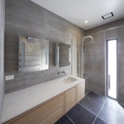 In this bathroom design by Rachel Barnes, the bathroom, countertop, floor, home, interior design, real estate, room, sink, gray