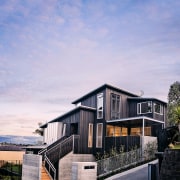 Designed by architect Robyn Bilkey and built by architecture, building, cottage, estate, facade, home, house, property, real estate, residential area, sky, purple