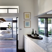 A servery connects the new kitchen to a door, home, house, interior design, real estate, window, gray, white