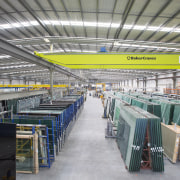 The new Metro Performance Glass manufacturing facility is airport terminal, factory, industry, manufacturing, mass production, steel, warehouse, gray