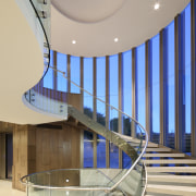 Nestled in the stair tower seen from the apartment, architecture, ceiling, daylighting, estate, glass, handrail, interior design, leisure centre, lobby, real estate, stairs, structure, gray