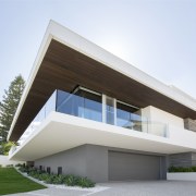 The living floor of this seaside house by architecture, building, commercial building, corporate headquarters, elevation, facade, home, house, official residence, property, real estate, residential area, villa, white