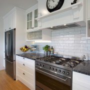 Open, breezy and welcoming, this kitchen designed by cabinetry, countertop, cuisine classique, floor, home, home appliance, interior design, kitchen, kitchen appliance, kitchen stove, room, gray