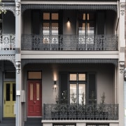 The freshly restored, elegant facade on this house architecture, balcony, building, door, facade, home, house, neighbourhood, property, real estate, residential area, window, black, white
