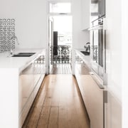 This new kitchen gains light from the breezeblock countertop, floor, flooring, interior design, kitchen, product design, tap, white