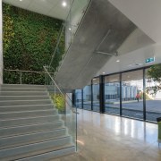Green and growing  a living wall greets architecture, daylighting, glass, handrail, house, interior design, real estate, structure, window, gray
