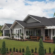 Finishes on this home include Resene Half Masala cottage, elevation, estate, facade, farmhouse, home, house, landscape, neighbourhood, property, real estate, residential area, roof, siding, villa, window, white, brown