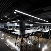 For this fit-out, original concrete floors were retained architecture, ceiling, interior design, table, black