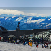 The jutting air vents and chimney, pointed roofline, alps, arctic, atmosphere of earth, cloud, fell, geological phenomenon, glacial landform, mountain, mountain range, mountainous landforms, piste, ski equipment, sky, snow, tourism, vacation, winter, gray, teal