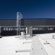 The safety systems on NorthWest Shopping Centre are architecture, building, corporate headquarters, daytime, facade, roof, sky, structure, blue, white