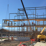 This University of Tasmania campus building uses a construction, scaffolding, structure, teal