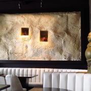 At Tokyo Bay restaurant a faux stone wall interior design, room, wall, black, white