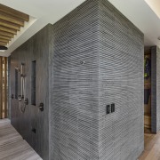 The wall in this spacious two-person shower is architecture, ceiling, floor, flooring, interior design, lobby, real estate, wall, wood, wood flooring, gray