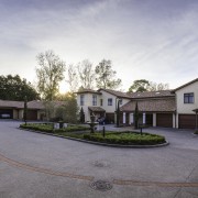 St Andrews Village lives up to its village courtyard, estate, facade, home, house, mansion, neighbourhood, property, real estate, residential area, sky, suburb, gray