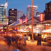 Residents at Wynyard Quarter have access to a city, cityscape, downtown, evening, metropolis, metropolitan area, mixed use, night, sky, skyline, skyscraper, town, urban area, red
