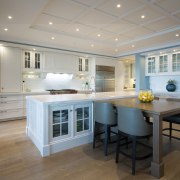 This kitchen combines traditional woodworking detail with large cabinetry, ceiling, countertop, cuisine classique, floor, flooring, home, interior design, kitchen, real estate, room, wood flooring, gray