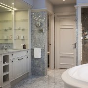 The intricately worked cabinetry in this master bathroom bathroom, bathroom accessory, bathroom cabinet, floor, home, interior design, room, gray