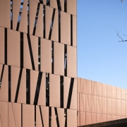 Interior workings of the new theatre building are architecture, brick, building, daytime, facade, font, landmark, sky, structure, wall, orange