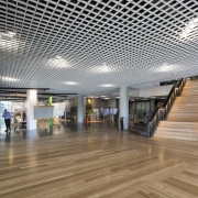 For an industrial touch, the foyer at the architecture, ceiling, daylighting, floor, flooring, interior design, lobby, gray