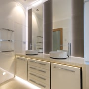 The wall mirrors are backlit in this renovated architecture, bathroom, ceiling, countertop, interior design, kitchen, product design, real estate, room, sink, gray, orange