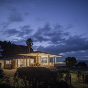 This substantial renovation of a lakeside home by architecture, atmosphere, cloud, cottage, darkness, dawn, dusk, estate, evening, farmhouse, highland, home, horizon, house, landscape, lighting, mansion, meteorological phenomenon, morning, nature, night, phenomenon, property, real estate, residential area, rural area, sky, sunlight, tree, blue, black