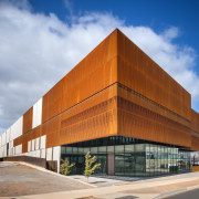 The facade of the South Australia Core Library architecture, building, commercial building, corporate headquarters, facade, headquarters, mixed use, real estate, sky, teal