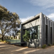 An understated landscape element? No, this is a architecture, building, cottage, facade, home, house, property, real estate, black, gray