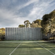 Not only is this new home in a architecture, area, building, cloud, daytime, estate, grass, house, landscape, plant, real estate, residential area, sky, sport venue, structure, sunlight, tree, gray