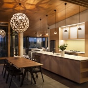 Bamboo cabinetry connects with the wider use of ceiling, countertop, dining room, interior design, kitchen, table, brown