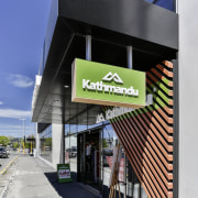 Scored precast panels, a high-performance glazing wall and building, commercial building, facade, black