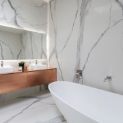 The upmarket aesthetic in this bathroom is achieved architecture, bathroom, floor, home, interior design, product design, room, tap, tile, wall, gray