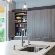 This kitchen by Lauren Levant Interior has an cabinetry, countertop, interior design, kitchen, gray