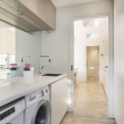 The generous bench space in this laundry is countertop, cuisine classique, floor, home appliance, interior design, kitchen, property, real estate, room, gray