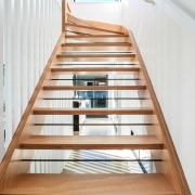 Wire inserts between the open treads on this apartment, architecture, daylighting, floor, glass, handrail, stairs, wood, white