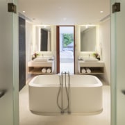 This ensuite bathroom features double wall hung vanities bathroom, bathroom accessory, interior design, plumbing fixture, product, product design, room, sink, orange