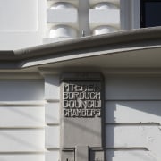 Built in 1912, the historic Council Chambers building architecture, building, facade, house, structure, wall, window, gray, white