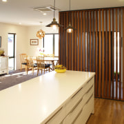 This clean, crisp family kitchen with timber floors cabinetry, countertop, floor, flooring, hardwood, home, interior design, kitchen, property, real estate, room, wall, window, wood, wood flooring, brown, yellow