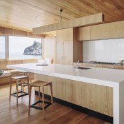 This kitchen in a home by Studio2 Architects architecture, countertop, floor, hardwood, house, interior design, kitchen, real estate, table, wood, wood flooring, gray, brown