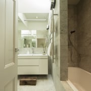 While traditional detailing was generally retained in this bathroom, bathroom accessory, bathroom cabinet, floor, home, interior design, room, sink, brown, yellow