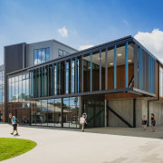 Metal, concrete panels with a rough-sawn wood pattern architecture, building, commercial building, corporate headquarters, facade, home, house, mixed use, real estate, residential area, gray, teal