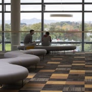 Looking east from the University of Waikatos new chair, couch, floor, flooring, furniture, house, interior design, living room, table, window, black, gray