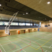 Acoustic ceiling panels keep noise under control in arena, basketball court, floor, hall, indoor games and sports, leisure, leisure centre, sport venue, sports, structure, brown