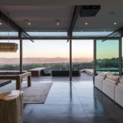 The steel post and beam construction in this architecture, condominium, estate, house, interior design, living room, real estate, window, black