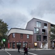 La Géode apartment block works hard to meld apartment, architecture, building, facade, home, house, mixed use, neighbourhood, property, real estate, residential area, sky, town, gray, black