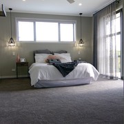 The master bedroom in this Fowler Homes Orewa architecture, bed frame, bedroom, ceiling, floor, room, gray, black